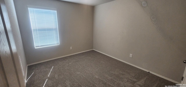 7115 Mesa Clfs, Converse, TX 78109 - unfurnished room featuring dark colored carpet and baseboards