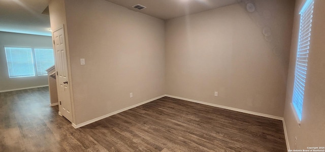 7115 Mesa Clfs, Converse, TX 78109 - spare room with dark wood-style floors and baseboards