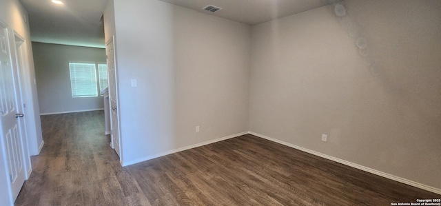 7115 Mesa Clfs, Converse, TX 78109 - unfurnished room featuring dark wood-style floors and baseboards