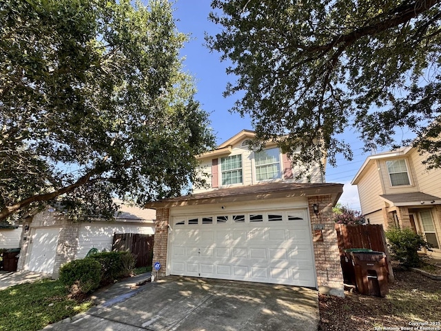 6914 Sandy Pt, San Antonio, TX 78244 - view of front of property featuring a garage, concrete driveway, and brick siding