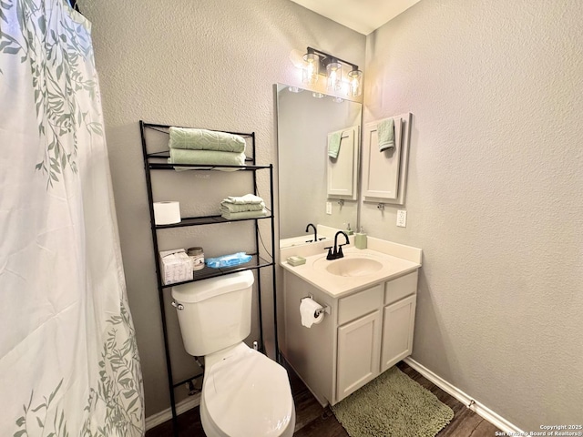 6914 Sandy Pt, San Antonio, TX 78244 - bathroom with vanity, wood finished floors, and a shower with curtain