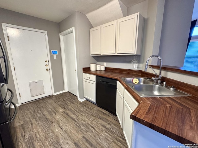 6914 Sandy Pt, San Antonio, TX 78244 - kitchen with black dishwasher, butcher block countertops, and white cabinets