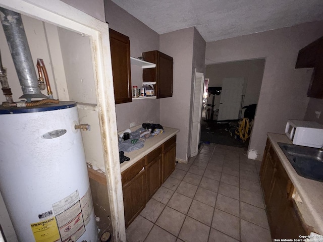 918 Potomac, San Antonio, TX 78202 - bathroom featuring water heater and tile patterned floors