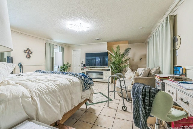 2102 Border Ml, San Antonio, TX 78230 - bedroom featuring light tile patterned floors, a textured ceiling, and crown molding