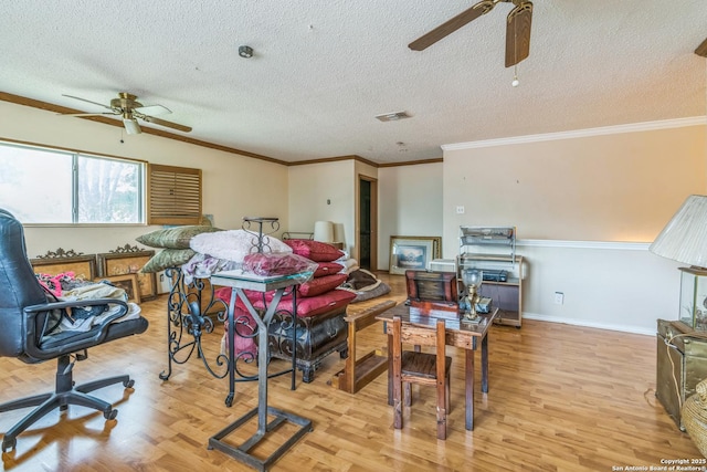 2102 Border Ml, San Antonio, TX 78230 - living room with a ceiling fan, wood finished floors, ornamental molding, and a textured ceiling