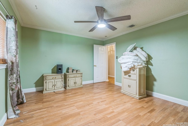 2102 Border Ml, San Antonio, TX 78230 - bedroom featuring light wood-type flooring, ornamental molding, a textured ceiling, and ceiling fan