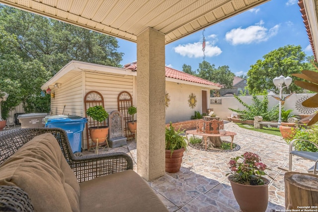 2102 Border Ml, San Antonio, TX 78230 - fenced backyard with a patio area