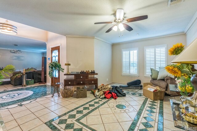 2102 Border Ml, San Antonio, TX 78230 - living area featuring tile patterned floors, ceiling fan, and crown molding