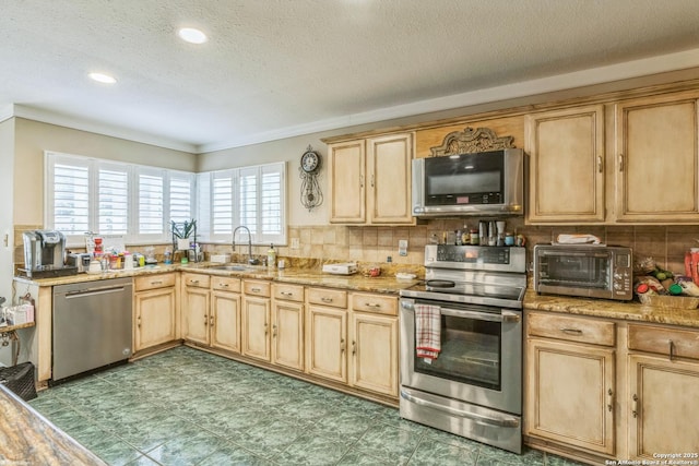 2102 Border Ml, San Antonio, TX 78230 - kitchen featuring appliances with stainless steel finishes, light brown cabinets, a textured ceiling, crown molding, and tasteful backsplash