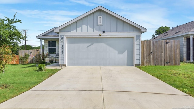 7207 Rosada Way, San Antonio, TX 78218 - view of front facade with board and batten siding, driveway, and a garage