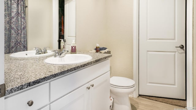 7207 Rosada Way, San Antonio, TX 78218 - full bath featuring vanity and wood finished floors