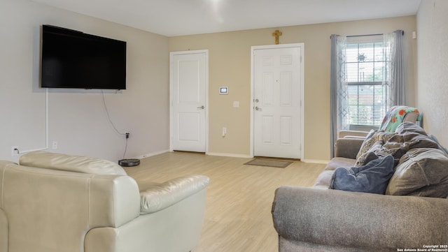 7207 Rosada Way, San Antonio, TX 78218 - living room with light wood-style flooring and baseboards