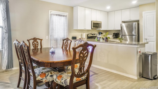7207 Rosada Way, San Antonio, TX 78218 - dining space featuring light wood finished floors, healthy amount of natural light, and recessed lighting