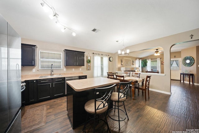 10410 Appaloosa Bay, San Antonio, TX 78254 - kitchen with appliances with stainless steel finishes, light countertops, a kitchen bar, and a center island
