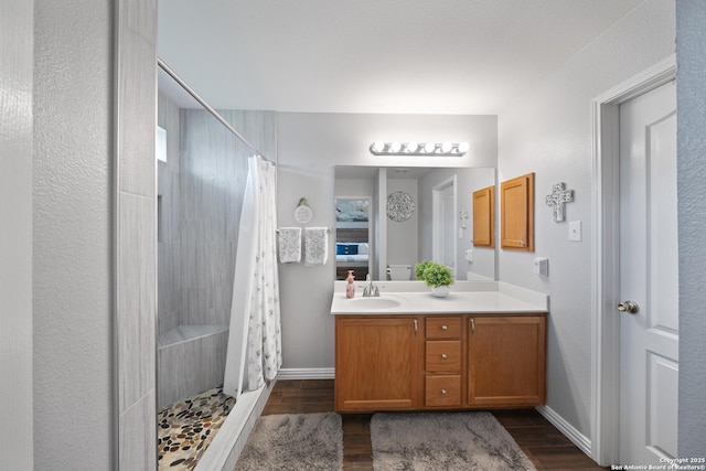 10410 Appaloosa Bay, San Antonio, TX 78254 - full bath with vanity, tiled shower, and wood finished floors