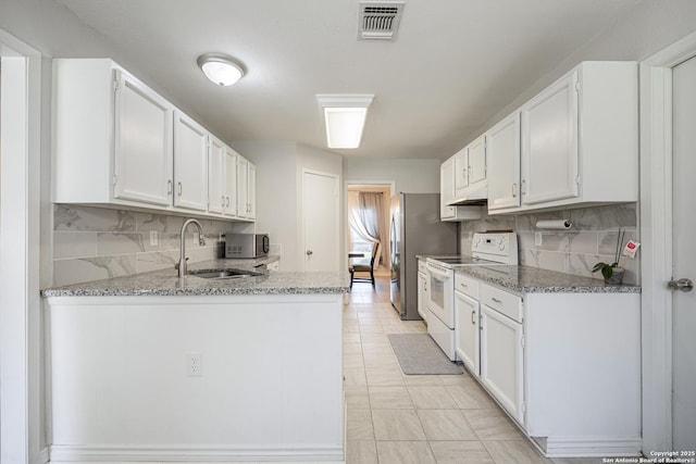 16334 Boulder Pass, San Antonio, TX 78247 - kitchen featuring stainless steel appliances, white cabinets, tasteful backsplash, and light stone countertops