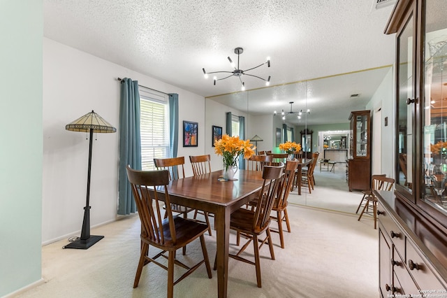 3523 Red Oak, San Antonio, TX 78230 - dining area with a chandelier, light carpet, and a textured ceiling