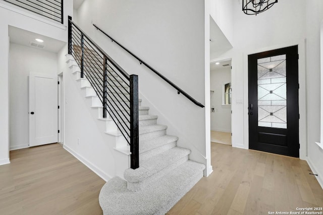 233 Alpine, New Braunfels, TX 78130 - foyer with stairs, wood finished floors, and a high ceiling