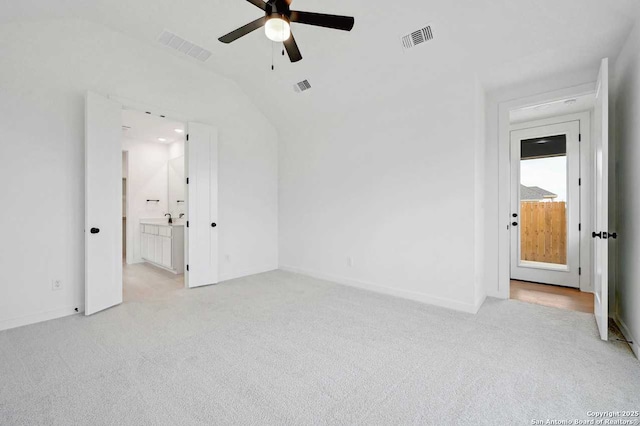 233 Alpine, New Braunfels, TX 78130 - unfurnished bedroom with carpet floors, lofted ceiling, ensuite bathroom, and a ceiling fan