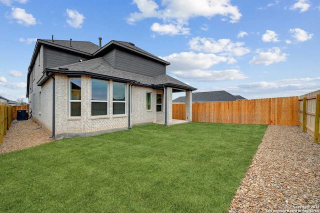 233 Alpine, New Braunfels, TX 78130 - rear view of house with a fenced backyard, roof with shingles, and brick siding