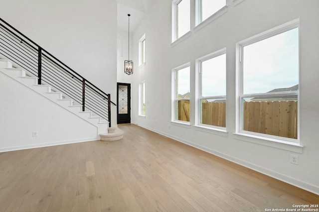 233 Alpine, New Braunfels, TX 78130 - entrance foyer featuring wood finished floors, stairway, and a high ceiling