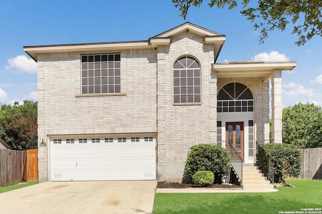 10223 Cactus Vly, San Antonio, TX 78254 - view of front of house with an attached garage, concrete driveway, and brick siding