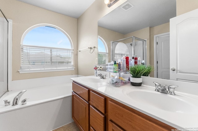 10223 Cactus Vly, San Antonio, TX 78254 - bathroom featuring a stall shower, a garden tub, and double vanity