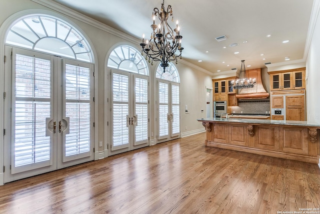 600 Thelma, Olmos Park, TX 78212 - kitchen with french doors, a chandelier, custom range hood, paneled refrigerator, and recessed lighting