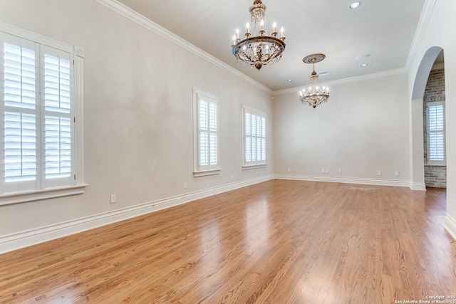 600 Thelma, Olmos Park, TX 78212 - empty room with a chandelier, arched walkways, light wood-type flooring, ornamental molding, and recessed lighting