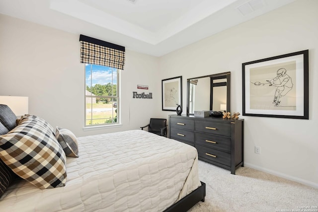 1587 Vista View Dr, Pleasanton, TX 78064 - bedroom featuring light colored carpet and a tray ceiling