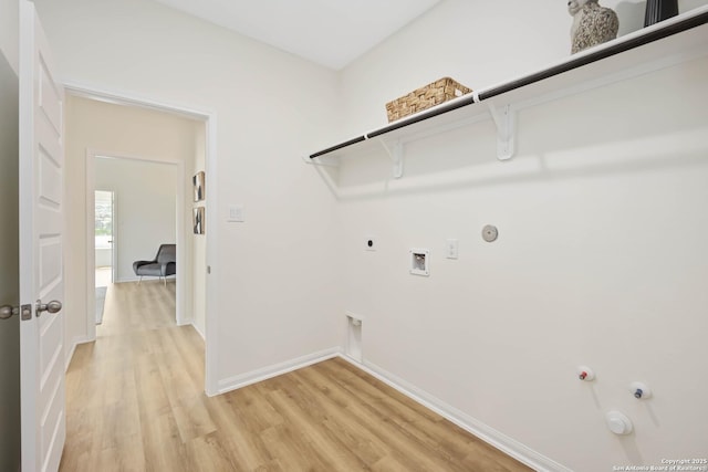 1587 Vista View Dr, Pleasanton, TX 78064 - washroom with gas dryer hookup, washer hookup, light wood-style flooring, and hookup for an electric dryer
