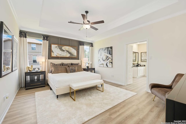 1587 Vista View Dr, Pleasanton, TX 78064 - bedroom featuring multiple windows, light wood finished floors, ornamental molding, and a tray ceiling