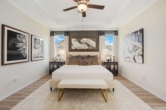 1587 Vista View Dr, Pleasanton, TX 78064 - bedroom with a raised ceiling, light wood finished floors, ornamental molding, and ceiling fan