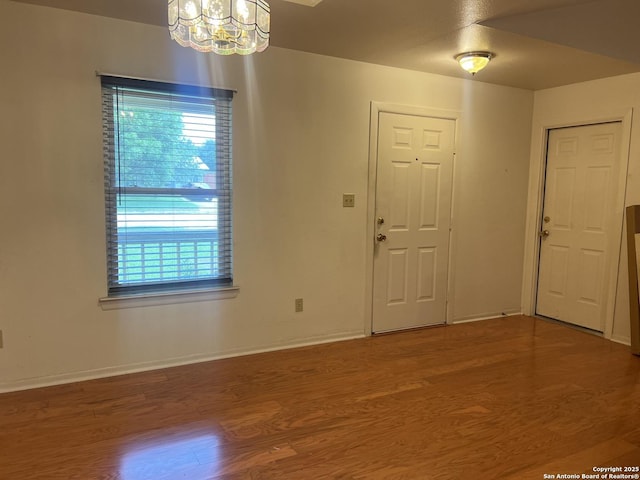 1503 Jami, Pleasanton, TX 78064 - entryway with a chandelier and wood finished floors