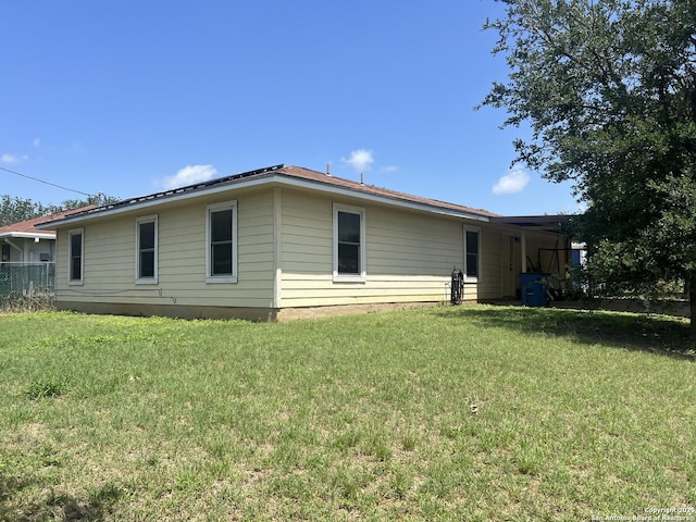 1503 Jami, Pleasanton, TX 78064 - rear view of house with a yard