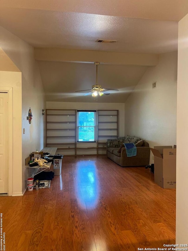 1503 Jami, Pleasanton, TX 78064 - living area featuring vaulted ceiling, a ceiling fan, and wood finished floors