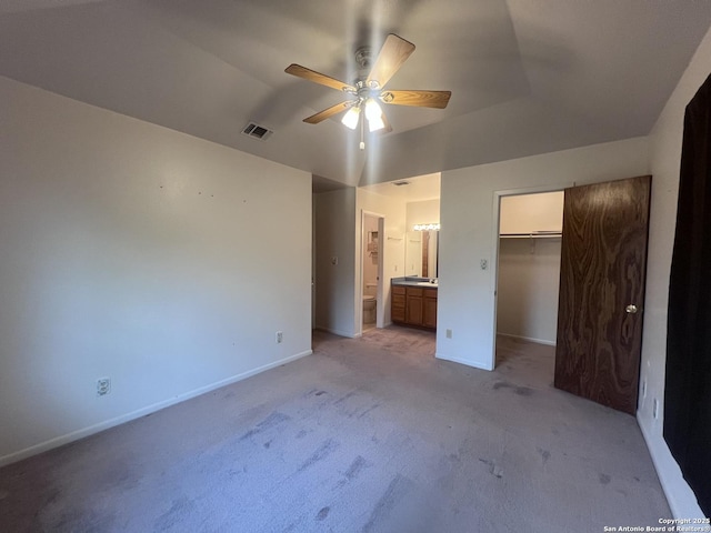 1503 Jami, Pleasanton, TX 78064 - unfurnished bedroom with light colored carpet, ensuite bathroom, vaulted ceiling, a closet, and ceiling fan