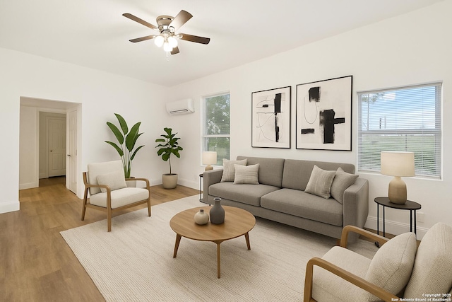 102 Aganier Ave, San Antonio, TX 78212 - living room with an AC wall unit, plenty of natural light, and light wood finished floors