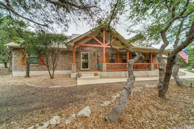 1777 Crossbow, Canyon Lake, TX 78133 - view of front facade with covered porch and brick siding