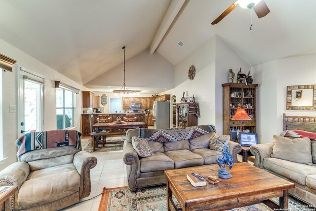 1777 Crossbow, Canyon Lake, TX 78133 - living room featuring light tile patterned floors, beam ceiling, ceiling fan, high vaulted ceiling, and a chandelier