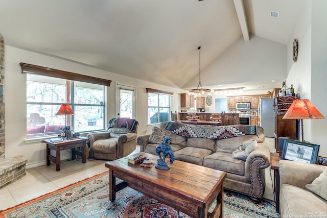 1777 Crossbow, Canyon Lake, TX 78133 - living room featuring beam ceiling, light tile patterned floors, and high vaulted ceiling