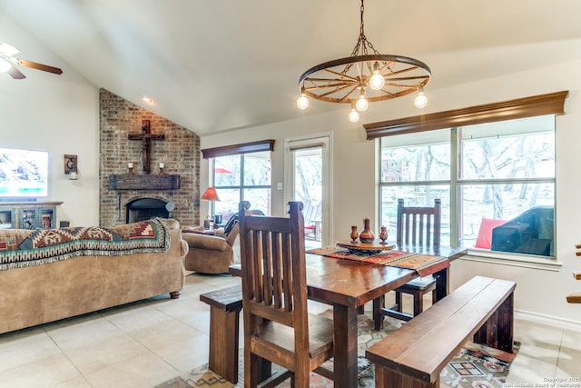 1777 Crossbow, Canyon Lake, TX 78133 - dining room with lofted ceiling, light tile patterned floors, a ceiling fan, and a chandelier