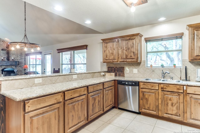 1777 Crossbow, Canyon Lake, TX 78133 - kitchen with stainless steel dishwasher, a peninsula, light tile patterned floors, decorative backsplash, and light stone countertops