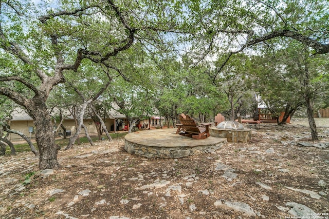 1777 Crossbow, Canyon Lake, TX 78133 - view of yard with an outdoor fire pit