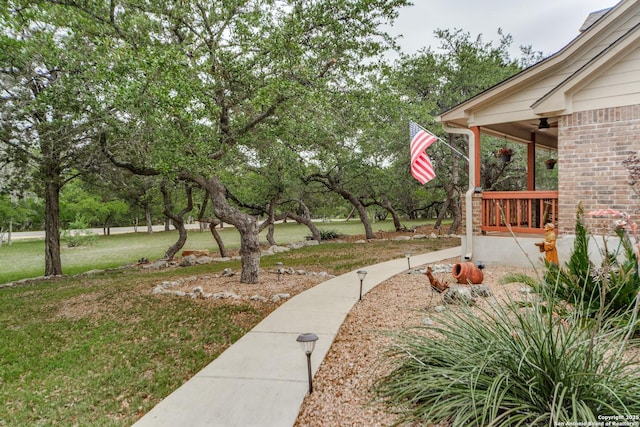 1777 Crossbow, Canyon Lake, TX 78133 - view of green lawn with a ceiling fan and covered porch