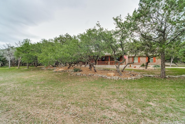 1777 Crossbow, Canyon Lake, TX 78133 - view of grassy yard with covered porch