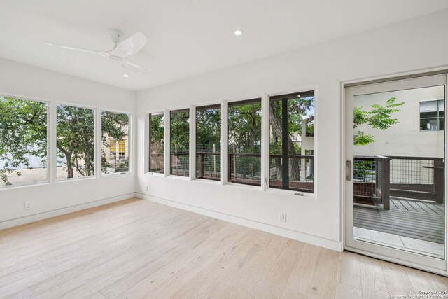 305 Joliet Unit D, San Antonio, TX 78209 - unfurnished sunroom featuring wood finished floors and recessed lighting