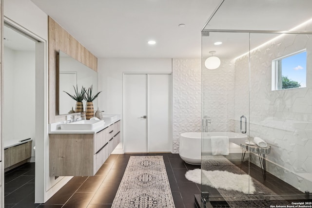 305 Joliet Unit D, San Antonio, TX 78209 - bathroom featuring vanity, a soaking tub, tile patterned flooring, a shower with door, and recessed lighting