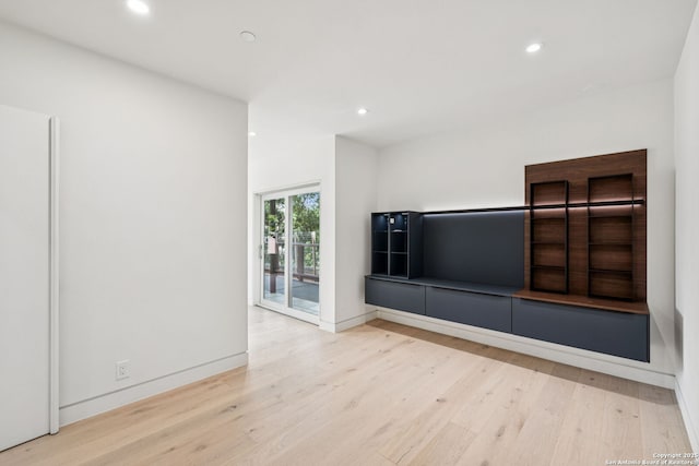 305 Joliet Unit D, San Antonio, TX 78209 - unfurnished living room with wood finished floors and recessed lighting