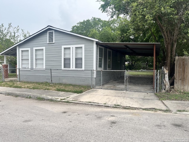 503 Grosvenor, San Antonio, TX 78221 - view of front of property with a fenced front yard, a gate, a carport, and concrete driveway